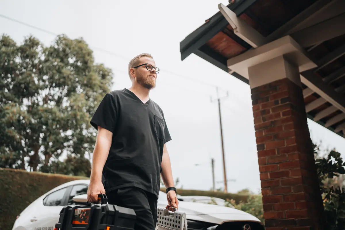 Luke arriving for a home visit carrying his mobile podiatry equipment