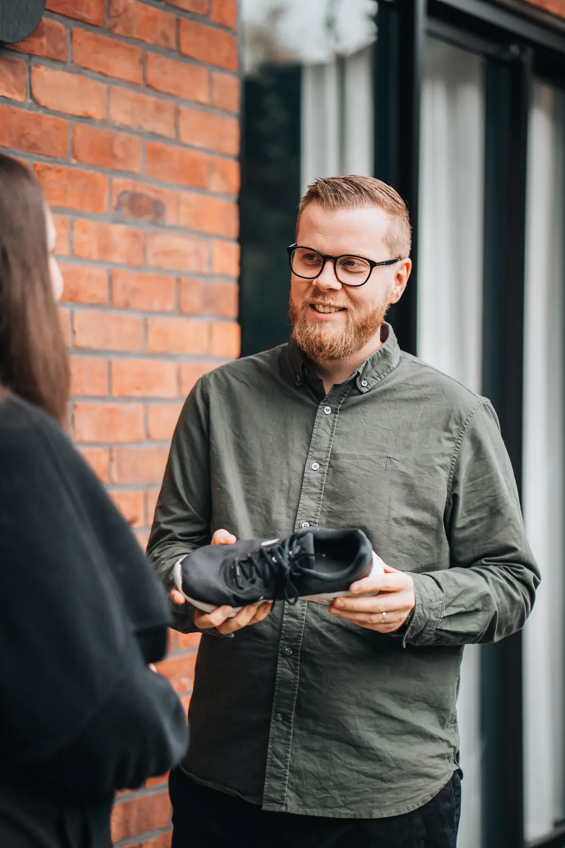 Podiatrist discussing supportive footwear with a client