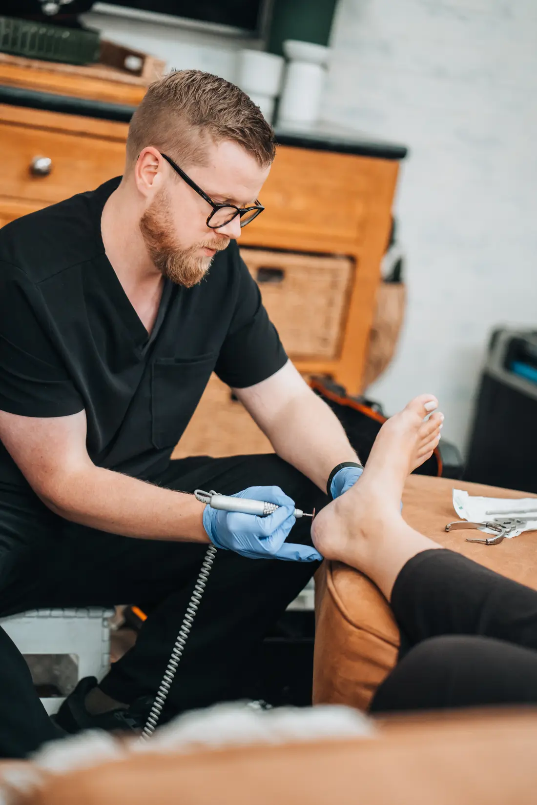 Podiatrist treating the foot to help with heel and arch pain